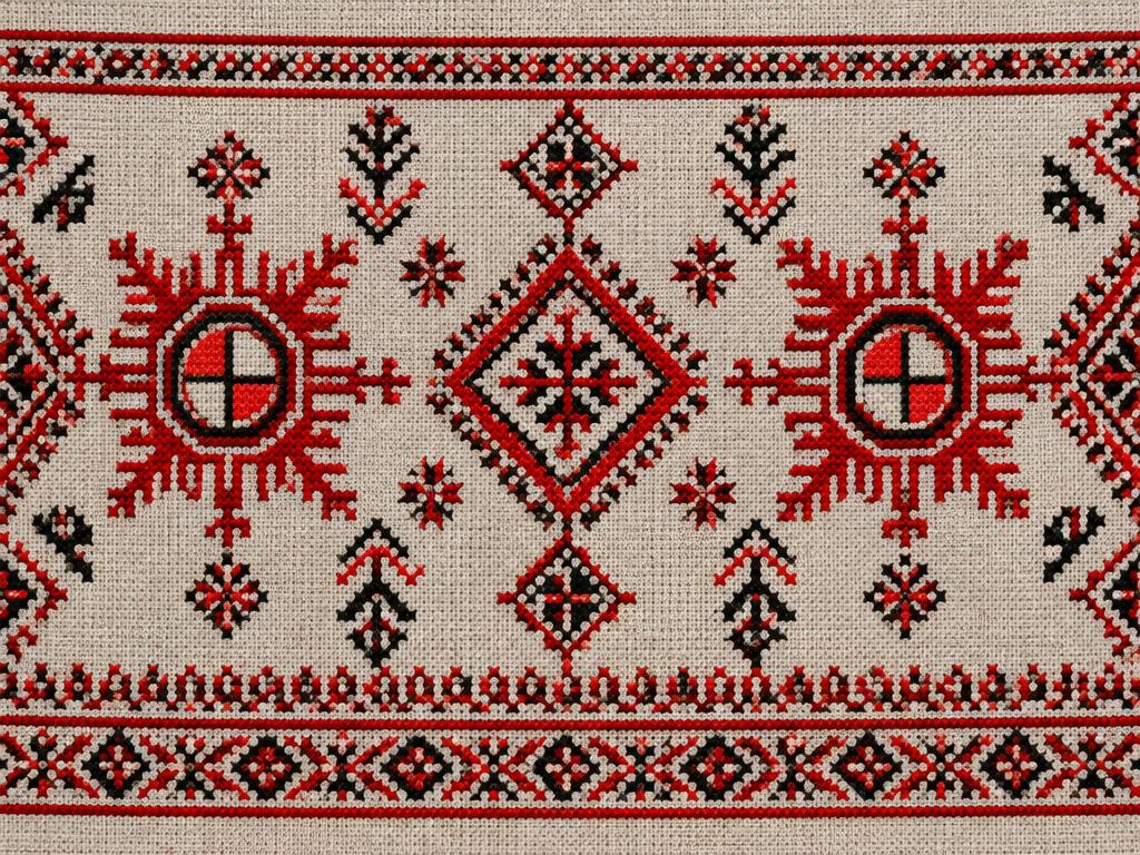 Traditional Chuvash embroidery with geometric sun symbols in red and black on linen